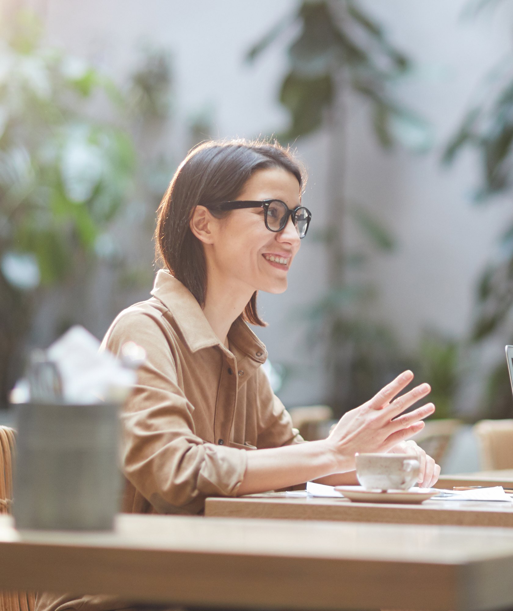 Patient talking with a care coordinator over paperwork at a table