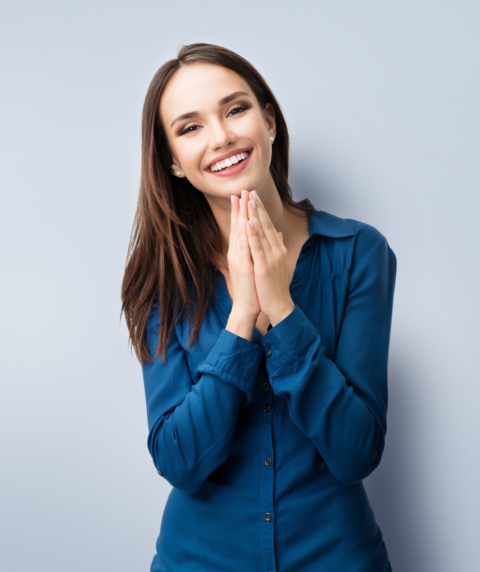 Smiling woman welcoming new patients to a convenient orthodontic practice